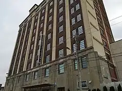 Exterior eastern facade of the Tower Automotive Building from the ground
