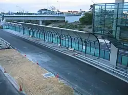 A bus station viewed from a bridge above