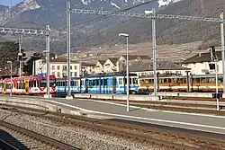 Aigle train station with AOMC, ASD and AL trains (from left to right)