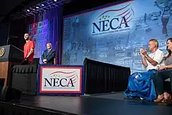 President Donald J. Trump welcomes IBEW 98 apprentice Liam Nicolette to the podium at the National Electrical Contractor Association Tuesday, October 2, 2018, at the Pennsylvania Convention Center in Philadelphia.