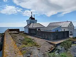On the east side of the Tvistein lighthouse station a massive wall offers protection from the waves.
