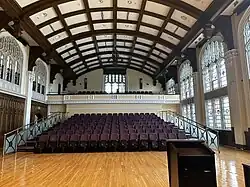 Tiered seating with balcony visible.