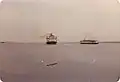 The SS Naushon passing the MV&nbsp;Uncatena in Nantucket harbor, September 1979.