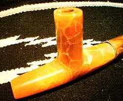 Uncompahgre Ute Salmon Alabaster Ceremonial Pipe. Ute pipe styles are similar to those of the Plains Indians, with notable differences. Ute pipes are thicker and use shorter pipestems than the Plains style, and more closely resemble the pipe styles of their Northern neighbors, the Shoshone.