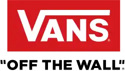 Storefront with large "VANS" sign and display windows showing shoes