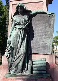 Finnish Maiden carrying the lyrics of Vårt land in front of the Statue of Johan Ludvig Runeberg.
