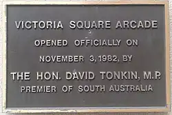 Plaque marking the opening of the Victoria Square Arcade (now Central Market Arcade) by Premier David Tonkin on 3 November 1982. Currently located at the Victoria Square entrance to the Central Market Arcade.