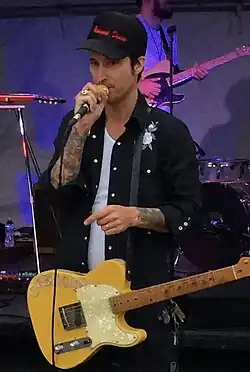 Dombroski performing with the Orbitsuns in 2014