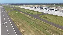 Terminal, runway and surrounding apron in January 2025