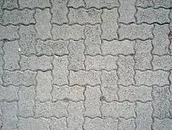 Pavement with herringbone pattern in Salzburg. Glide reflection axis runs northeast–southwest