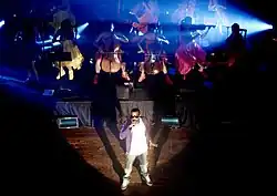 West accompanied by an orchestra