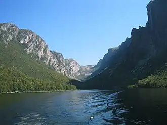 body of water with mountains in background