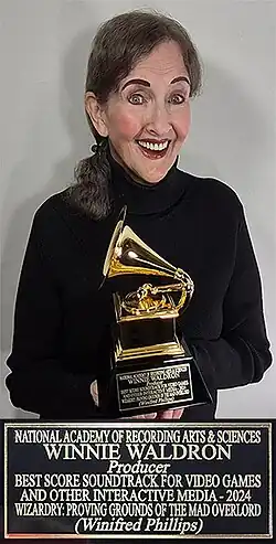 Music producer Winnie Waldron receiving her Grammy Award for her work on the video game Wizardry: Proving Grounds of the Mad Overlord.)