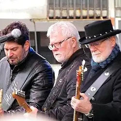 Members of YU Grupa performing live in Belgrade in 2018, from left to right: Petar, Dragi and Žika Jelić
