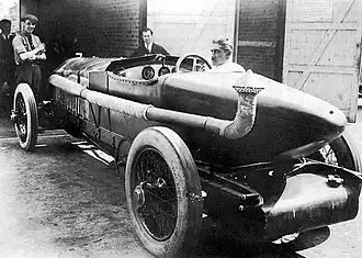 A 1920s car with an eight-foot long bonnet