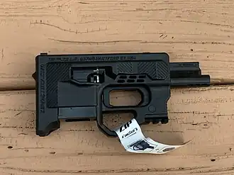 The ZiP .22 LR from the right in factory new condition. No stickers removed, safety off, empty magazine loaded.